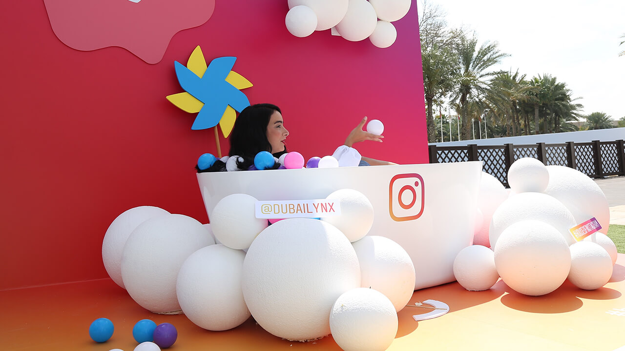  A woman posing at Dubai Lynx event's Instagram photo booth at the Cabsat event in Dubai 