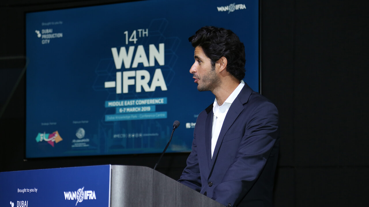 A man addressing a gathering at the 14th WAN-IFRA Middle East Conference in 2019 in Dubai